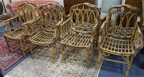A set of eight Regency design rattan conservatory elbow chairs
